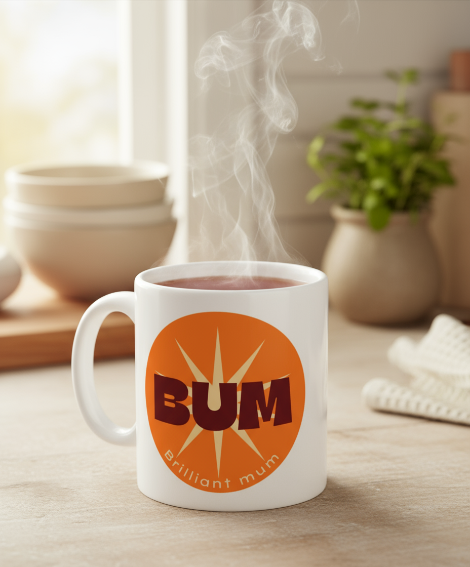 White mug with 'BUM Brilliant mum' design on a wooden surface with steam rising from it.