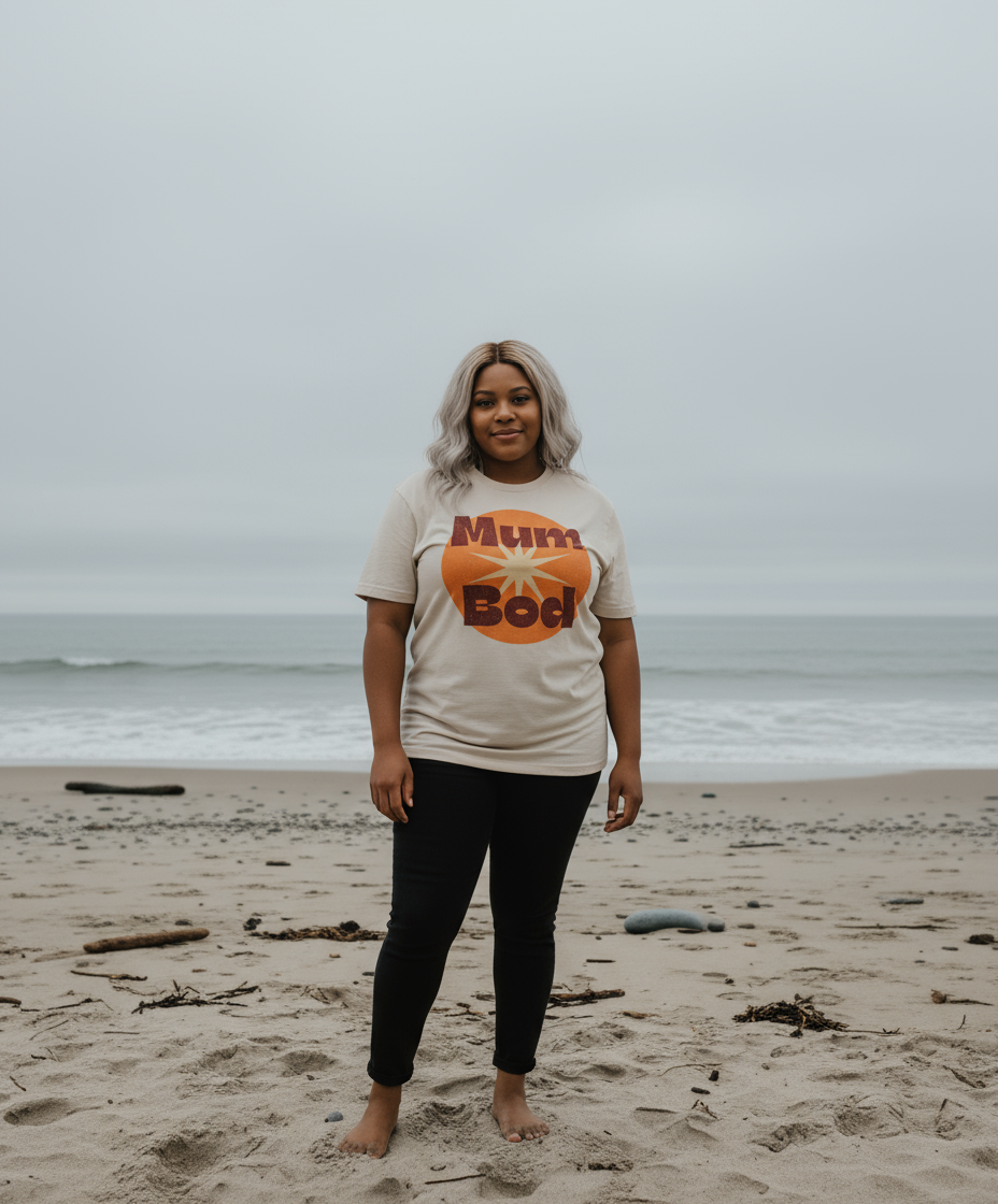 Person wearing a 'Muffin Bod' t-shirt on a beach